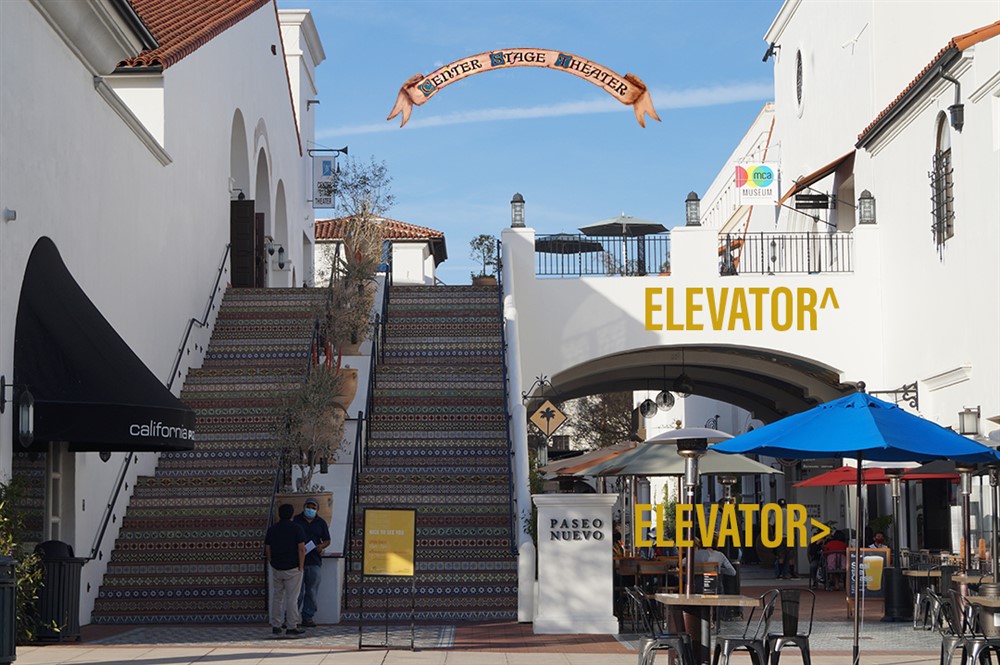 Paseo Nuevo Stairs on Chapala Street showing elevator locations on right-side wall near the ATM. Also Accesses the basement parking area